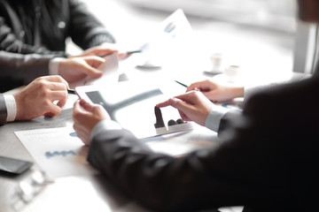 close up.the businessman uses a digital tablet for his work