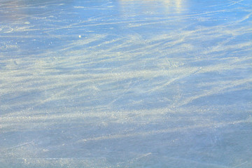 Ice rink with snow in the stadium. Close-up. Background. Texture.
