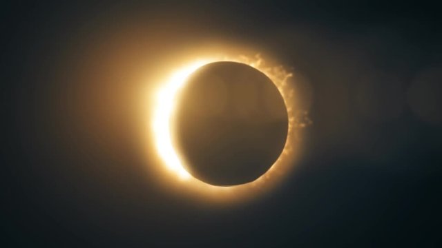 Abstraction of solar eclipse. Ring of fire on a black background.