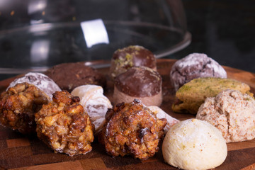 Variety of cookies on wooden plate