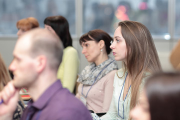 business woman on the background of colleagues in the conference room