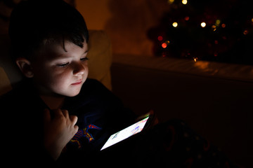 child with smarthphone at christmas