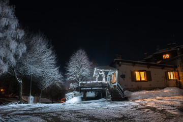 lighted house at sunset