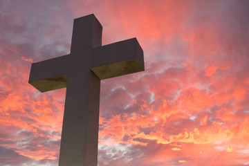 Magnificent heavenly cross with a pink sunset