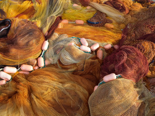 traditional fishing nets and floats on a pier