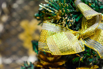 Artificial Christmas and New Year Fir-Tree with gift box, cone, gold ribbon bow