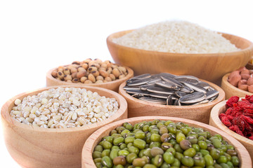 Cereal grains , seeds, beans on wooden background