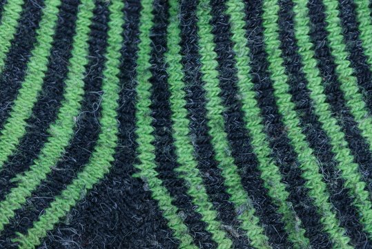 Black Green Striped Fabric Texture From Woolen Old Fabric On The Sock