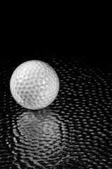 white Golf Ball on metal