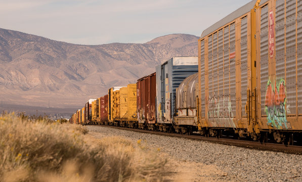 a long lens shot of a freight train in the desert near Mojave California.