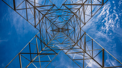 under a large steel power tower with interesting design features