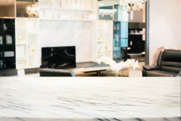 Blurred abstract of modern living room with marble shelf and TV.