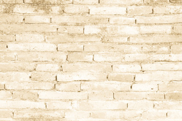Cream colors and brown brick wall art concrete or stone texture background in wallpaper limestone abstract paint to flooring and homework/Brickwork or stonework clean grid uneven interior rock old.