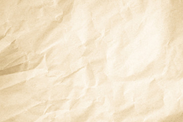 Brown background paper, crumpled texture and watercolor. Old vintage page with a glowing center and grunge vignette.
