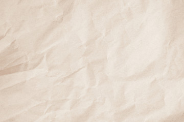 Brown background paper, crumpled texture and watercolor. Old vintage page with a glowing center and grunge vignette.