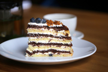 Macro photo of tasty cake with berries and tea