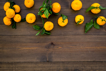 branch of mandarins for New Year and Christmas celebration on wooden background top view mockup