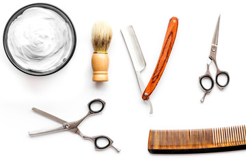 Instruments of male hairdresser barbershop top view on white background