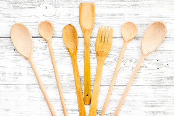 Village table with wooden cutlery set rustic background top view