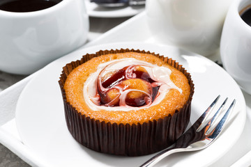 sweet cake with cream and berries jam