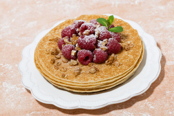 traditional thin pancakes with fresh raspberries