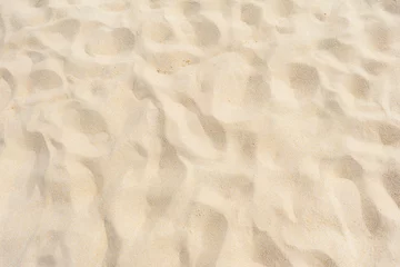 Fotobehang Fine beach sand in the summer sun © BUDDEE