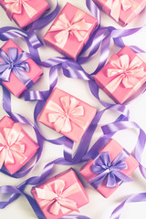 boxes with gifts for the holiday birthday Christmas Valentine's day pink on white background Top view flat lay vertical Selective focus