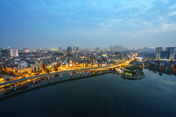 Fototapeta premium Aerial skyline view of Hanoi city, Vietnam. Hanoi cityscape by sunset period at Hoang Cau lake, Dong Da district