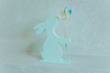 Beautiful wooden stands with flowers of different colors in flasks