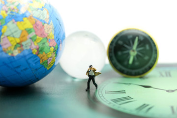 Miniature people : business man walking on the clock background, time business concept.