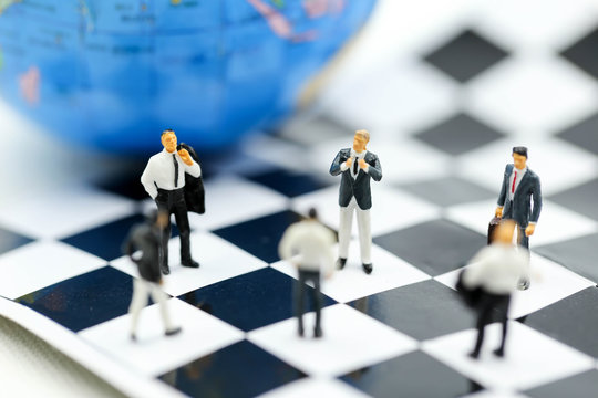 Miniature people : business team strategy training with chess,target, decision and competition concept.