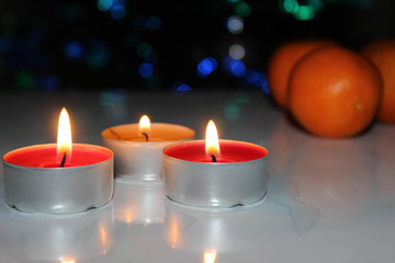 Candles and tangerines.
