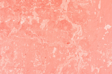 Texture, wall, concrete, living coral. It can be used as a background . Wall fragment with scratches and cracks