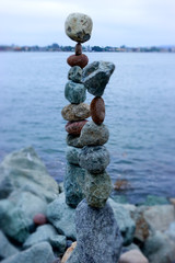 Tilt shift photo of stacked rocks on the coastline of San Diego, California