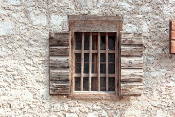 wooden window in an old stone house.