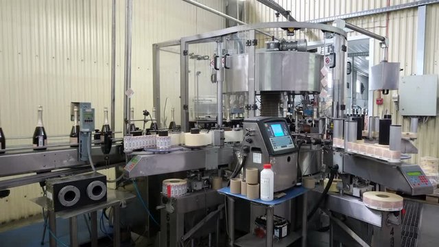 Line for bottling wine and labeling bottles