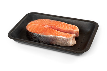 salmon steak in the package, isolated on white background.