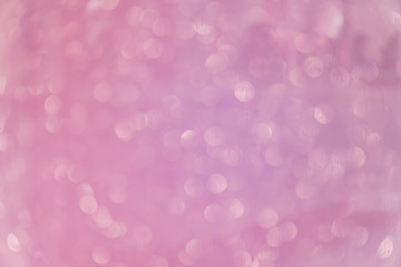Bokeh abstract texture. Beautiful christmas background in purple colors. Defocused
