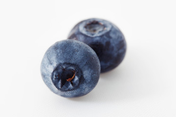 Fresh blueberry isolated on white. Two berries 