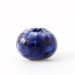 Obraz premium Fresh blueberry isolated on white. One big blueberry berry close-up