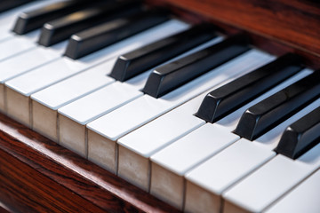 Fototapeta na wymiar Closeup image of a vintage wooden grand piano
