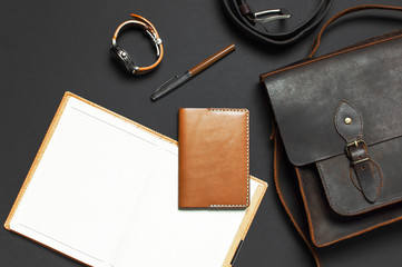 Fashionable concept. Brown leather men's bag, wristwatch, leather passport cover, pen, blank white...