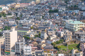 Fototapeta na wymiar Panorama view of Nagasaki city with montain and blue sky background, Cityscape, Nagasaki, Kyushu, Japan