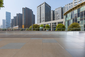 Panoramic skyline and modern business office buildings with empty road,empty concrete square floor