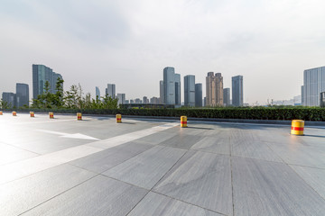 Panoramic skyline and modern business office buildings with empty road,empty concrete square floor