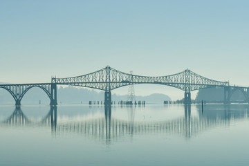 A bridge over the Coos River bay at its mouth next to the Oregon Dunes