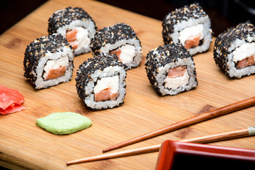 Maki Tuna sushi with philadelphia cheese and sesame seeds.
