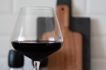 a glass of wine on a table close-up.