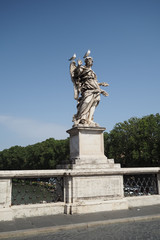 Fototapeta na wymiar Marble statue by Bernini on the Bridge of Angels, Rome, Italy, with two seagulls sitting on its head