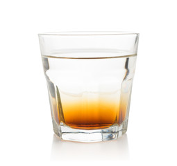 Double layer alcoholic cocktail in transparent glass isolated
